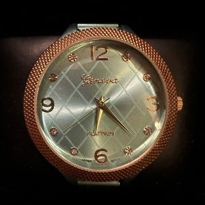 Teal and gold color watch